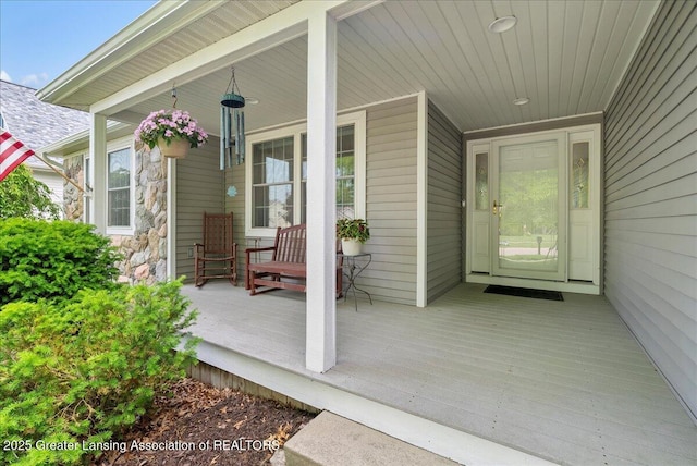 2308 Keller Rd, Holt, MI 48842 - property entrance featuring covered porch and stone siding