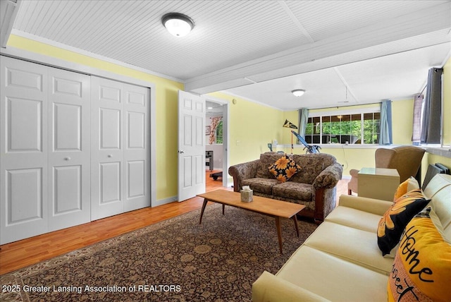 2308 Keller Rd, Holt, MI 48842 - living room featuring wood finished floors and ornamental molding