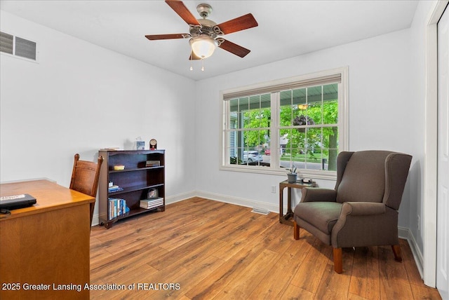 2308 Keller Rd, Holt, MI 48842 - living area featuring hardwood / wood-style flooring, a ceiling fan, and a desk