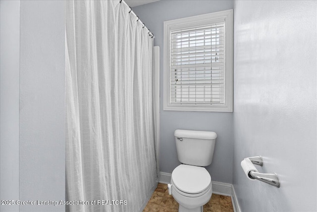 2308 Keller Rd, Holt, MI 48842 - full bath featuring toilet and baseboards