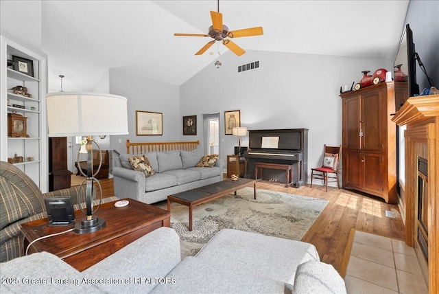 2308 Keller Rd, Holt, MI 48842 - living area with a ceiling fan, light wood-style flooring, and high vaulted ceiling