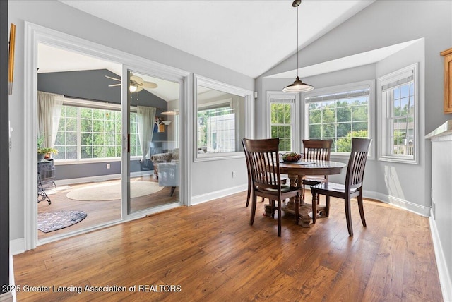 2308 Keller Rd, Holt, MI 48842 - dining room with lofted ceiling, wood finished floors, and a ceiling fan