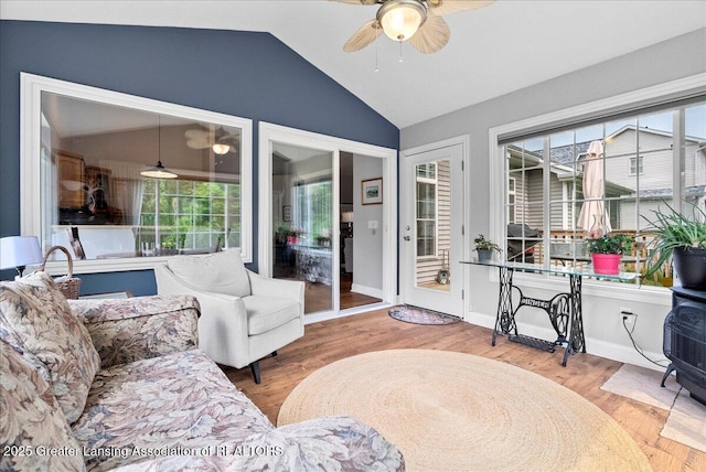 2308 Keller Rd, Holt, MI 48842 - living room with ceiling fan, vaulted ceiling, healthy amount of natural light, and wood finished floors