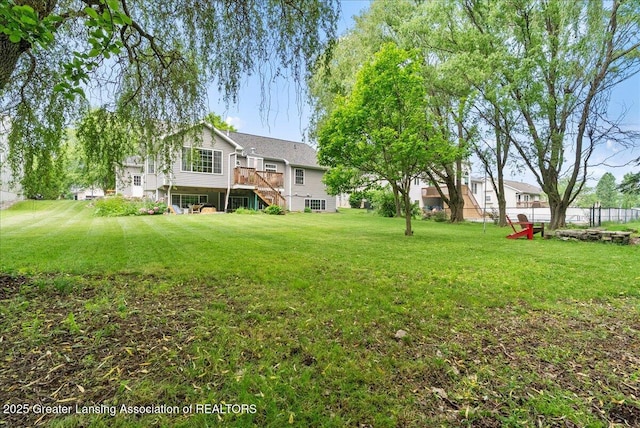 2308 Keller Rd, Holt, MI 48842 - view of yard featuring stairs and a wooden deck