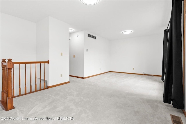 235 Bonnie Brook Dr Unit 1, Charlotte, MI 48813 - spare room featuring light colored carpet and baseboards