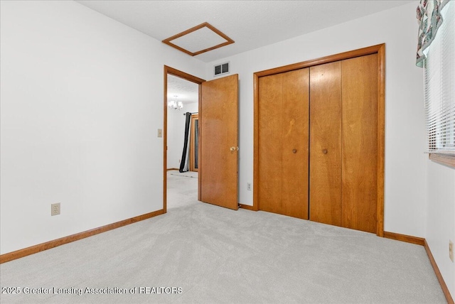 235 Bonnie Brook Dr Unit 1, Charlotte, MI 48813 - unfurnished bedroom featuring light carpet and a closet