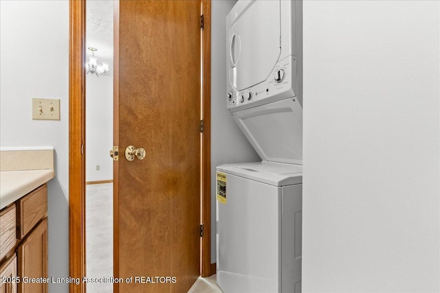 235 Bonnie Brook Dr Unit 1, Charlotte, MI 48813 - laundry area featuring stacked washer and clothes dryer