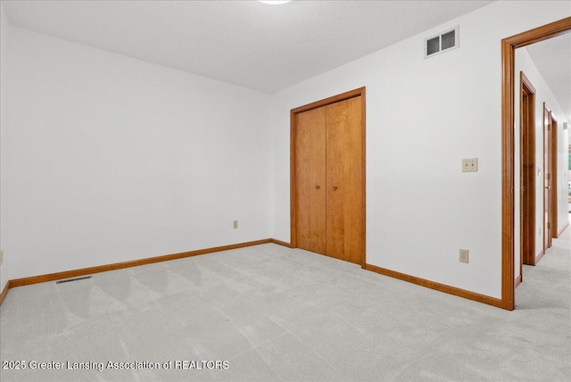 235 Bonnie Brook Dr Unit 1, Charlotte, MI 48813 - spare room with carpet floors and baseboards