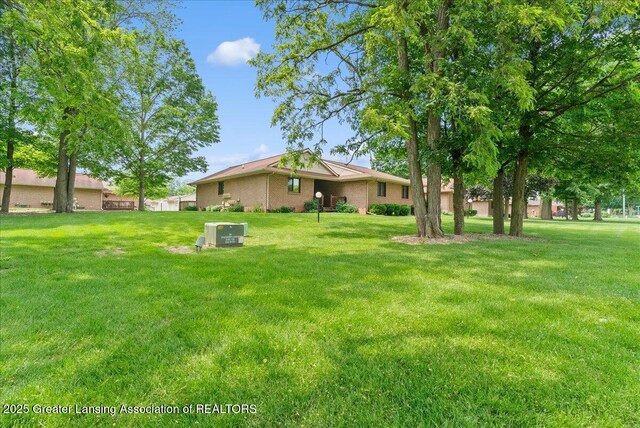 235 Bonnie Brook Dr Unit 1, Charlotte, MI 48813 - view of grassy yard