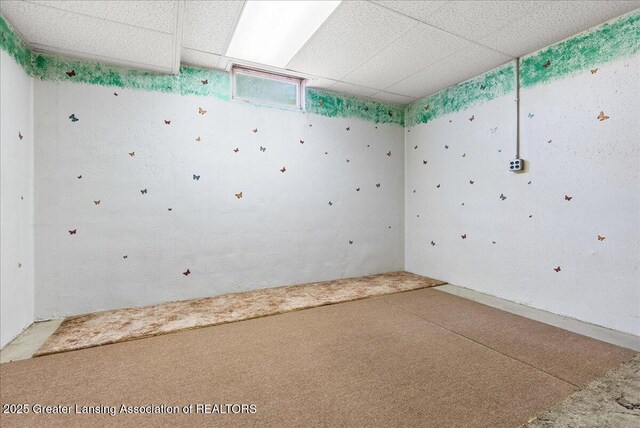 235 Bonnie Brook Dr Unit 1, Charlotte, MI 48813 - unfurnished room featuring a paneled ceiling and carpet