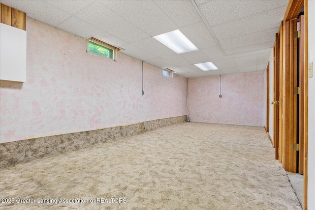 235 Bonnie Brook Dr Unit 1, Charlotte, MI 48813 - below grade area with carpet flooring and a paneled ceiling