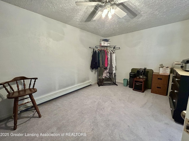 10497 Charlotte Hwy, Portland, MI 48875 - bedroom featuring a textured ceiling, light colored carpet, a baseboard radiator, and a ceiling fan