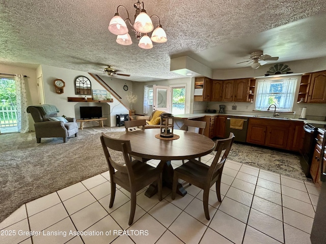 10497 Charlotte Hwy, Portland, MI 48875 - dining area with a ceiling fan, light colored carpet, light tile patterned flooring, a chandelier, and a textured ceiling