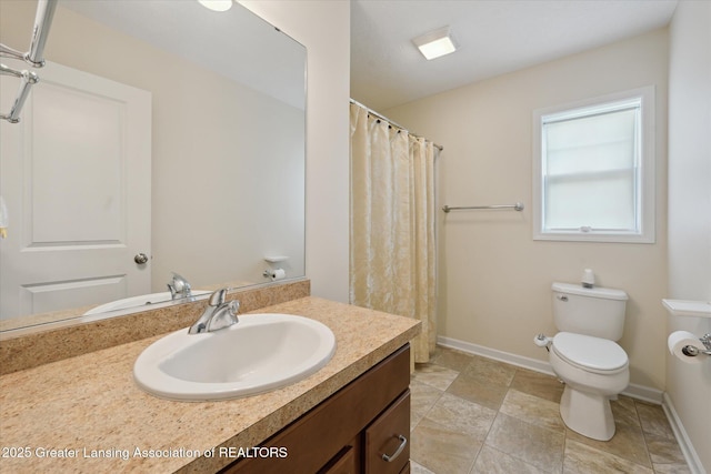 8687 Yellowstone Ln, Lansing, MI 48917 - bathroom with vanity, curtained shower, and stone finish floors