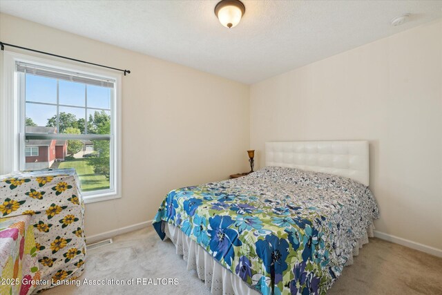 8687 Yellowstone Ln, Lansing, MI 48917 - bedroom featuring carpet and baseboards