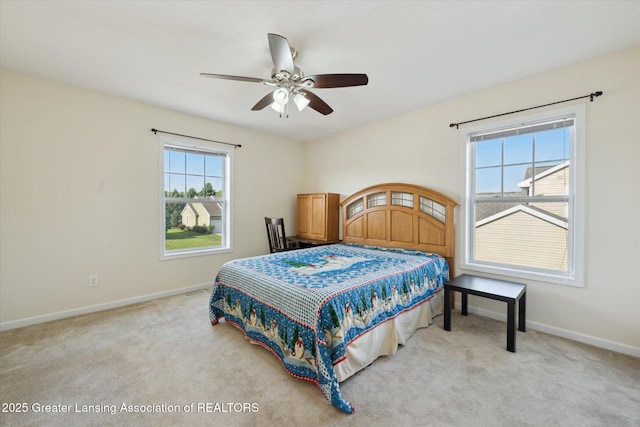 8687 Yellowstone Ln, Lansing, MI 48917 - bedroom with light carpet and a ceiling fan