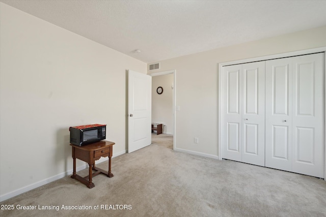 8687 Yellowstone Ln, Lansing, MI 48917 - unfurnished bedroom with carpet and a closet