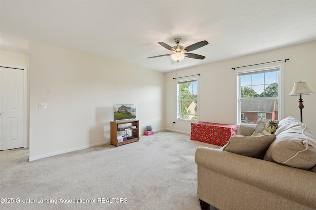 8687 Yellowstone Ln, Lansing, MI 48917 - living area featuring light colored carpet and a ceiling fan