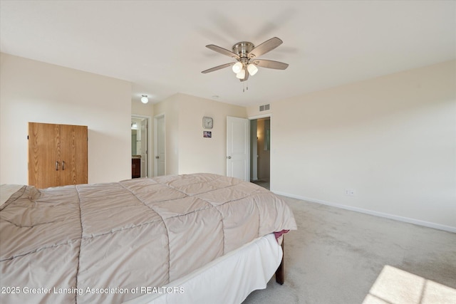 8687 Yellowstone Ln, Lansing, MI 48917 - bedroom with carpet flooring, ensuite bathroom, and a ceiling fan