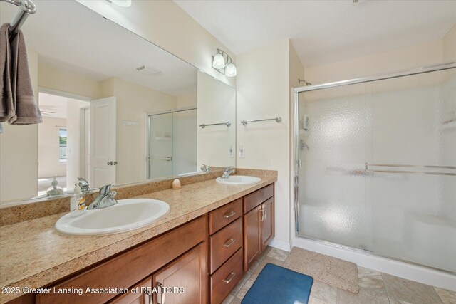 8687 Yellowstone Ln, Lansing, MI 48917 - bathroom featuring double vanity and a stall shower