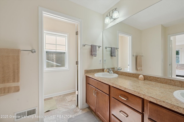 8687 Yellowstone Ln, Lansing, MI 48917 - full bathroom with double vanity