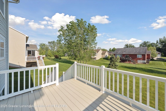 8687 Yellowstone Ln, Lansing, MI 48917 - wooden deck with a lawn and a residential view