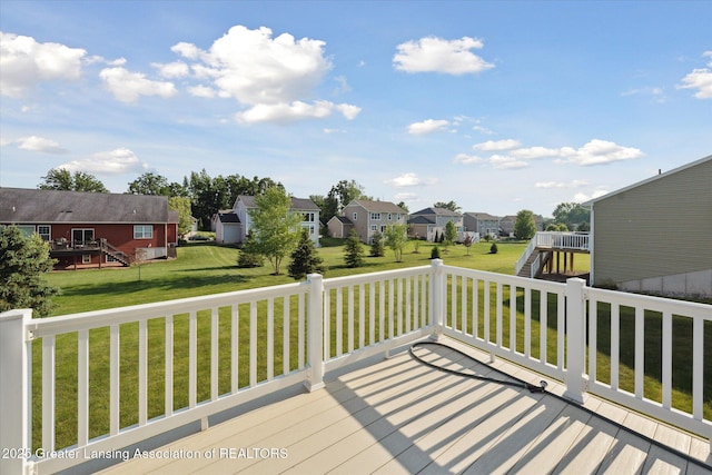8687 Yellowstone Ln, Lansing, MI 48917 - deck featuring a residential view, stairway, and a yard