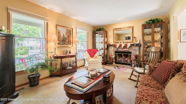 533 Middlebury Ln, Mason, MI 48854 - carpeted living room with healthy amount of natural light and a brick fireplace