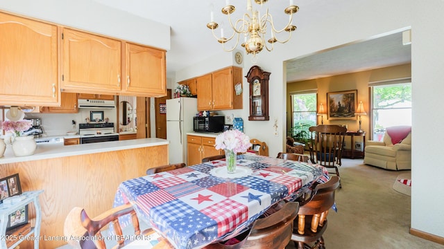 533 Middlebury Ln, Mason, MI 48854 - dining area with light carpet and a chandelier