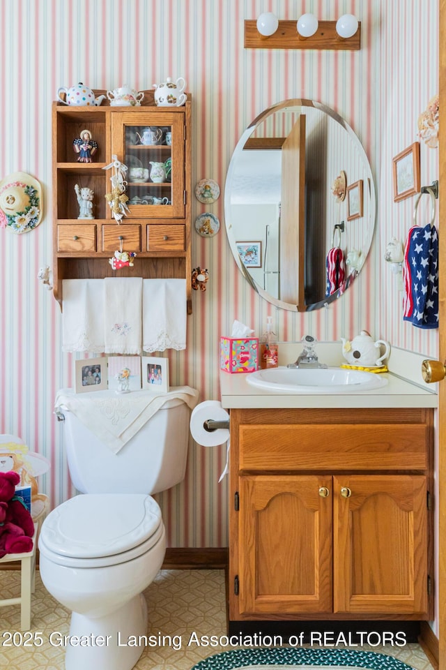 533 Middlebury Ln, Mason, MI 48854 - bathroom with wallpapered walls and vanity