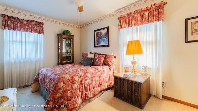 533 Middlebury Ln, Mason, MI 48854 - bedroom featuring light carpet and ceiling fan
