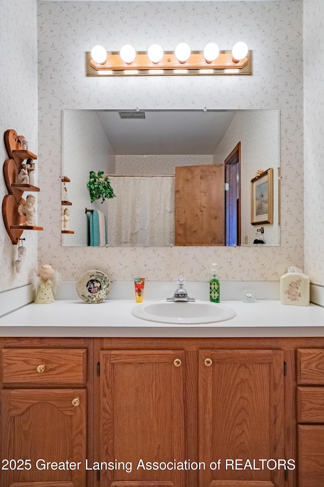 533 Middlebury Ln, Mason, MI 48854 - bathroom with wallpapered walls and vanity