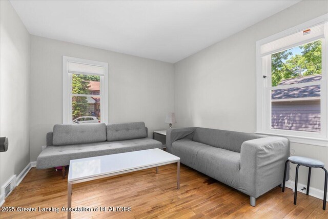 952 Sunset Ln, East Lansing, MI 48823 - living area featuring plenty of natural light and wood finished floors