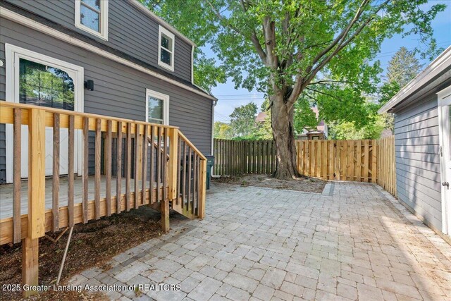 952 Sunset Ln, East Lansing, MI 48823 - fenced backyard with a deck and a patio area