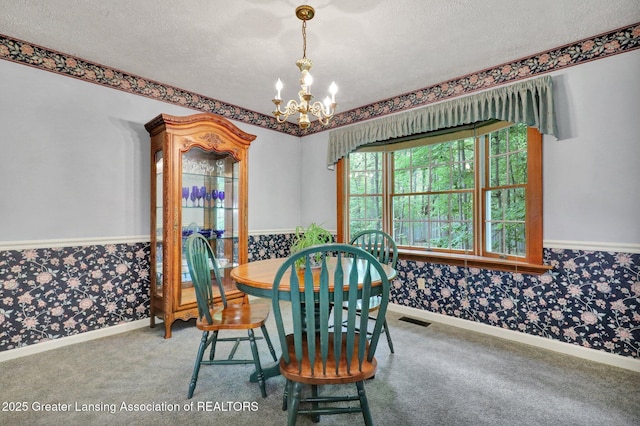 1204 Burlington Dr, Grand Ledge, MI 48837 - carpeted dining space featuring wallpapered walls, a textured ceiling, and a chandelier