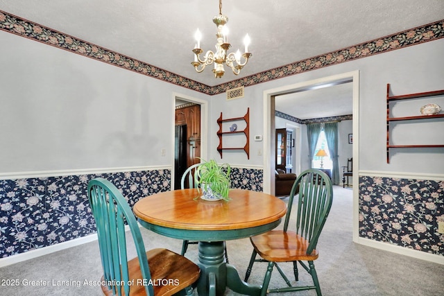 1204 Burlington Dr, Grand Ledge, MI 48837 - dining area featuring a chandelier, carpet, wallpapered walls, and a textured ceiling