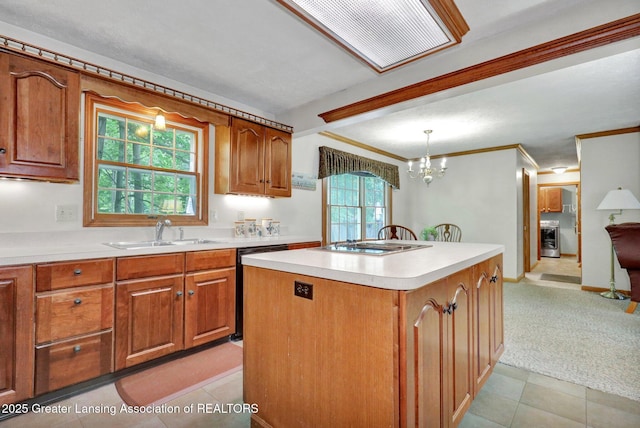 1204 Burlington Dr, Grand Ledge, MI 48837 - kitchen with dishwashing machine, brown cabinets, light countertops, and ornamental molding