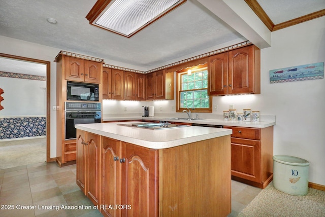 1204 Burlington Dr, Grand Ledge, MI 48837 - kitchen with black appliances, light countertops, brown cabinetry, and a kitchen island