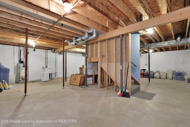 1204 Burlington Dr, Grand Ledge, MI 48837 - unfinished below grade area featuring water heater and stairs