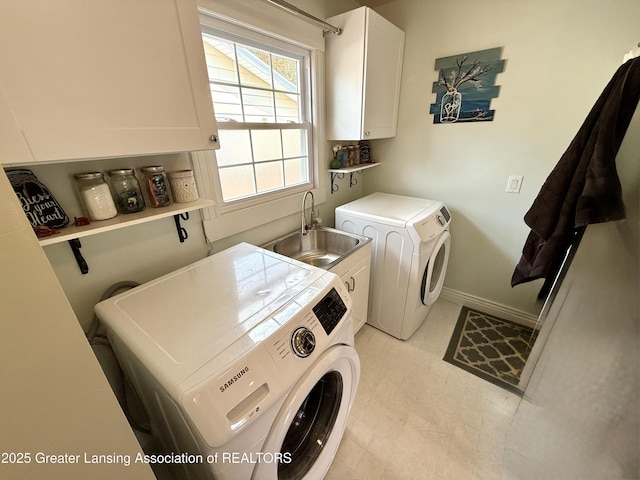 3321 Springbrook Ln, Lansing, MI 48917 - washroom with cabinet space and washer and clothes dryer