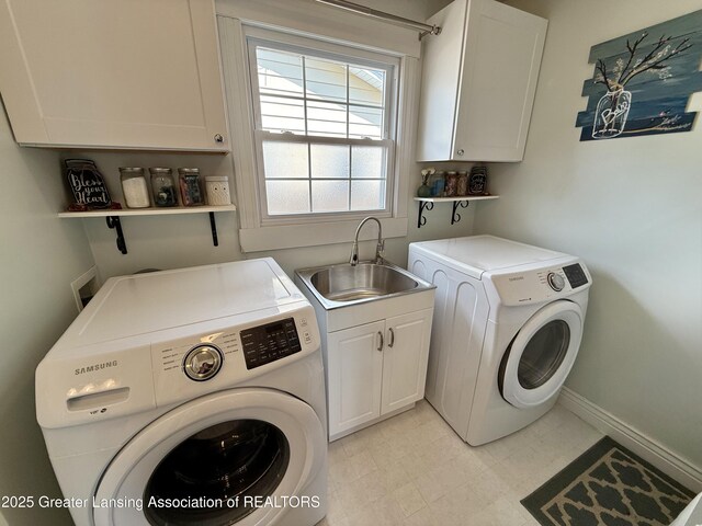 3321 Springbrook Ln, Lansing, MI 48917 - laundry area featuring cabinet space and washing machine and clothes dryer
