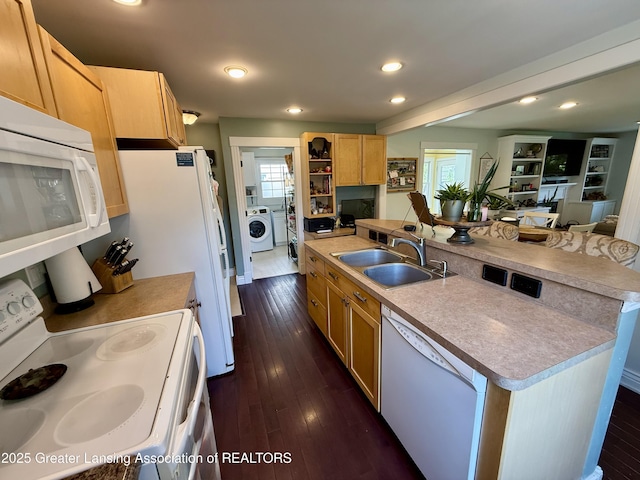 3321 Springbrook Ln, Lansing, MI 48917 - kitchen with white appliances, washer / clothes dryer, recessed lighting, healthy amount of natural light, and light brown cabinets