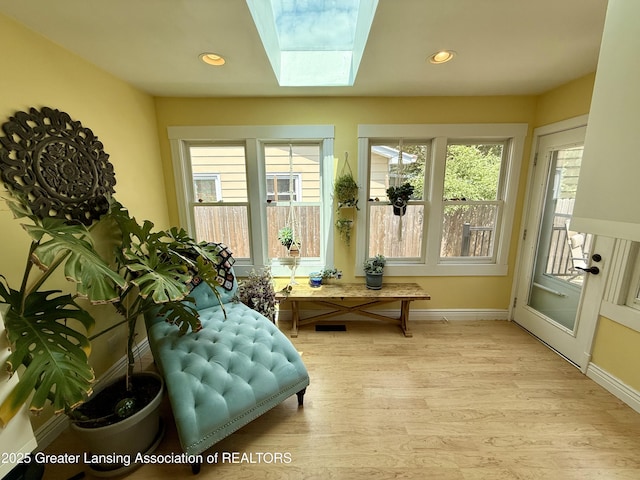 3321 Springbrook Ln, Lansing, MI 48917 - sunroom / solarium with wood finished floors, a skylight, and recessed lighting