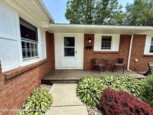 3321 Springbrook Ln, Lansing, MI 48917 - property entrance featuring brick siding and covered porch