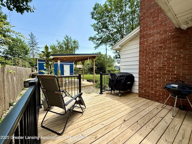 3321 Springbrook Ln, Lansing, MI 48917 - deck with a shed and a grill