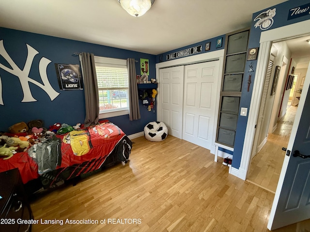 3321 Springbrook Ln, Lansing, MI 48917 - bedroom featuring light wood-type flooring and a closet