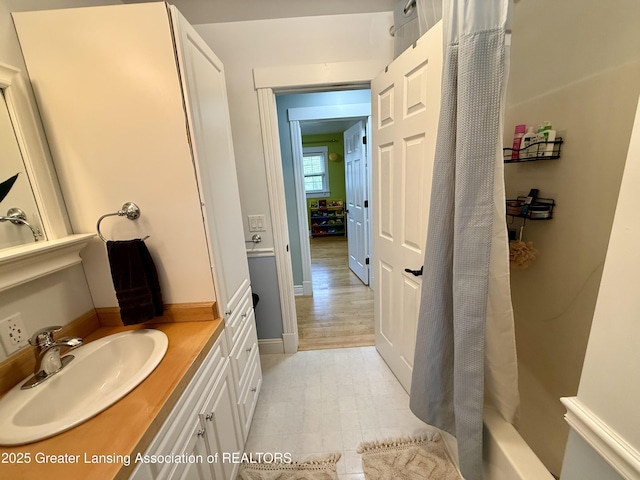 3321 Springbrook Ln, Lansing, MI 48917 - bathroom featuring vanity and shower / tub combo with curtain