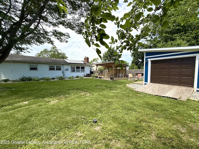 3321 Springbrook Ln, Lansing, MI 48917 - view of yard with a gazebo, a garage, and a patio