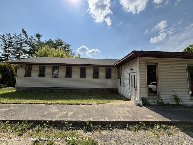 5681 Shaw St, Haslett, MI 48840 - view of property exterior with a patio