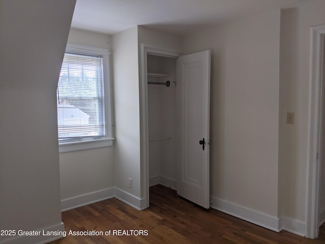 542 Riley St, Lansing, MI 48910 - unfurnished bedroom featuring wood finished floors and a closet